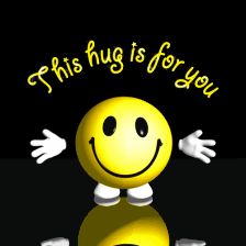 this hug is for you smiley face with arms and legs in front of black background