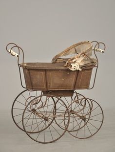 an old fashioned baby's carriage is shown