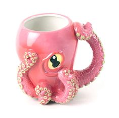 an octopus shaped coffee mug is shown on a white background