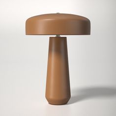 a brown table lamp sitting on top of a white floor