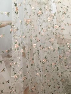 sheer curtains with pink flowers and leaves on them