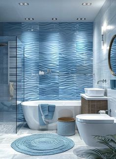 a bathroom with blue waves on the wall and white bathtub, sink, toilet and mirror