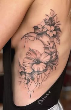 a woman's stomach with flowers on it