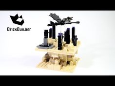 the lego model is made to look like it's floating on water and has black sails