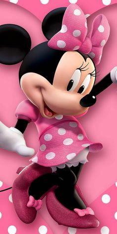 the minnie mouse is dancing in pink and white polka dots