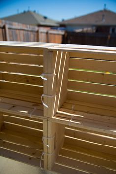 a wooden bench sitting on top of a patio