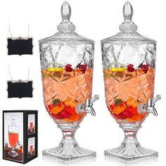 two glass goblets filled with different types of drinks and garnishes