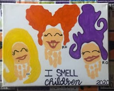 a painting of three girls with different colored hair and their faces painted on canvases