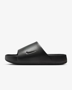 This is a NEW, never-worn, pair of Nike CALM SLIDE sandals in the "BLACK" or "Noir" colorway in Men's Size 6. These are Nike model FD4116-001 and they are amazing! Here is additional information on this incredible footwear: When it comes to these slides, it's all in the name. Take a deep breath and slip into a minimalist look with maximalist cushioning. Contoured foam is seamlessly created from one piece, and cradles your feet to help keep them in place. To top it off, the water-friendly design Black Modern Slip-on Slides, Black Slip-resistant Sandals With Round Toe, Slip-resistant Sandals For Streetwear, Nike Slides With Rubber Sole, Nike Slide Sandals With Rubber Sole, Nike Open Toe Slides With Rubber Sole, Comfortable Nike Slides With Rubber Sole, Nike Synthetic Slides With Rubber Sole, Nike Slides With Round Toe And Rubber Sole