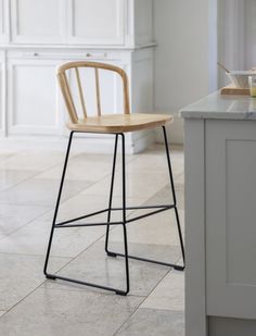 a wooden chair sitting on top of a kitchen counter