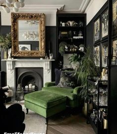 a living room filled with furniture and a fire place in front of a large mirror