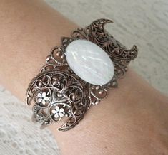 This beautiful copper filigree cuff bracelet has a copper triple moon design and a faceted resin opalite setting. Adjustable. Wicca Jewelry, Goddess Bracelet, Australian Opal Jewelry, Victorian Bracelet, Gothic Bracelet, Handwriting Jewelry, Goddess Jewelry, Wiccan Jewelry, Cuff Bracelets Handmade