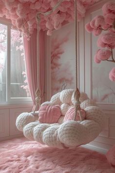 a bedroom with pink and white decorations on the ceiling