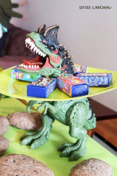 a toy dinosaur on a plate with crackers