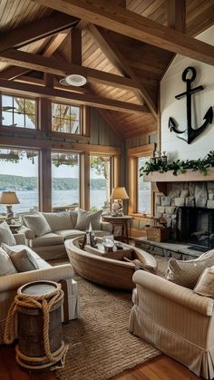 a living room filled with lots of furniture and a fire place in front of a window