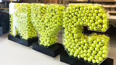 the letters are made out of tennis balls