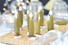 small candles are placed on a cutting board