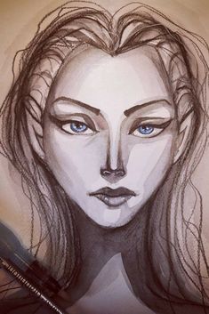 a drawing of a woman's face with blue eyes