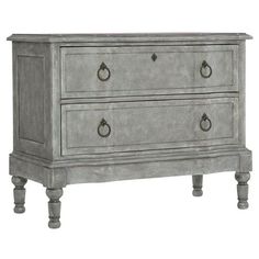 an old gray dresser with two drawers