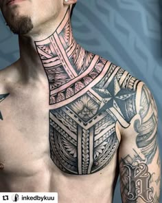 a man with tattoos on his chest and chest