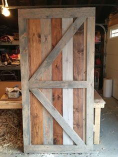 a barn door made out of wood in a garage