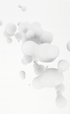 white bubbles floating in the air on a white background