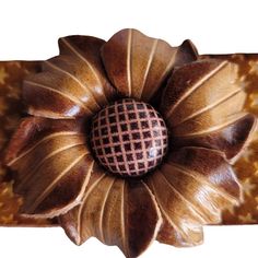 a decorative object with a flower on it's center piece in the shape of a sunflower