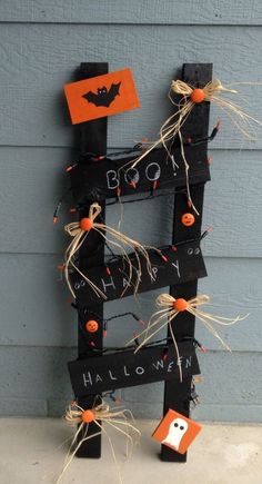 a wooden letter decorated with halloween decorations