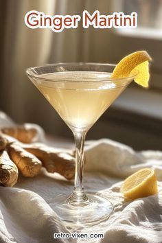 a glass filled with a drink sitting on top of a table next to sliced ginger