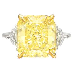 An exquisite 10 carat fancy yellow diamond ring set in platinum and 18 carats yellow gold the ring has been handmade in Italy with two side tapered baguettes also 100% eye clean and full of brilliance! Fancy Yellow Diamond Ring, Radiant Diamond Rings, Graff Diamonds, Orange Diamond, Yellow Diamond Ring, Radiant Cut Engagement Rings, Simulated Diamond Rings, Yellow Diamond Rings, Yellow Engagement Rings