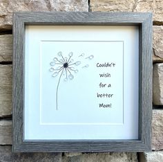 a frame with a dandelion on it that says couldn't wish for a better mom