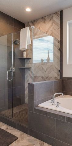 a bathroom with a walk in shower next to a bath tub