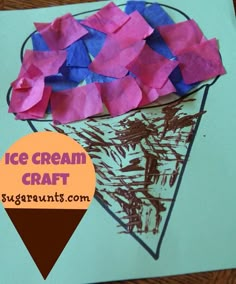 an ice cream cone with pink and blue tissue paper on it next to a piece of brown paper that says ice cream craft