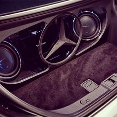 the interior of a mercedes benz car with its center console and speakers in place to play music