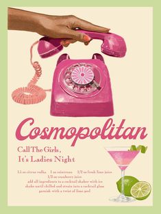 a pink telephone sitting on top of a table next to a martini