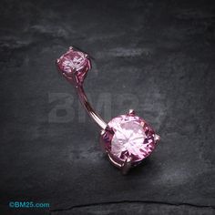 an image of a pink jeweled belly ring