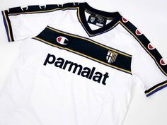 a soccer jersey with the word parmaat on it and two red circles around the chest