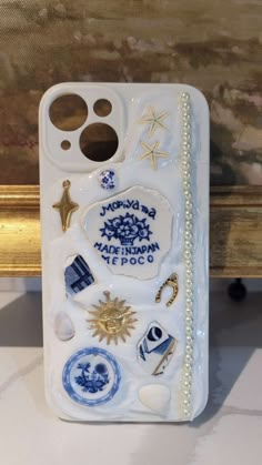 a cell phone case that has various stickers on it