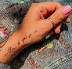 a woman's hand with a small tattoo on her left wrist that says, you are the one