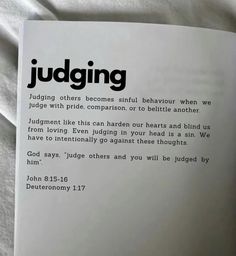 an open book with the words judging written in black and white on it's cover