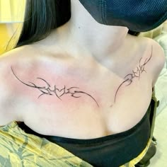 a woman with a tattoo on her chest