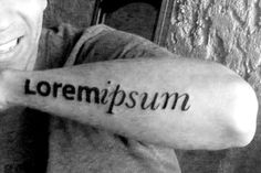 a man with a tattoo on his arm that says, lorempsum in black and white