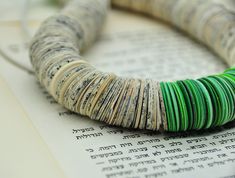 Paper Bead Necklace - an upcycled green beaded necklace that will upgrade ever outfit. This chunk avant-garde bohemian necklace is a unique piece of recycled jewelry. This lightweight paper bead necklace is handmade of hundreds of circular books and paper disc beads in green shades. It is finished with green wood beads. It is a bold & impressive necklace, and the fact that it is hand-made of recycled paper beads gives it that extra meaningful glamour. All my jewelry is 100% handmade. For me, the process of taking an extremely common material such as paper, and transforming it into valuable, unique jewelry, is incredibly fascinating and challenging. This statement beaded necklace will add that special touch of contemporary chic to your look. It will earn you endless compliments on your impe Retirement Gift For Teacher, Paper Bead Necklace, Chunky Bead Necklace, Avant Garde Jewelry, Paper Beads Necklace, Paper Bead Jewelry, Jewelry Chunky, Chunky Bead Necklaces, Green Beaded Necklace