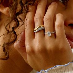 a close up of a person wearing a ring