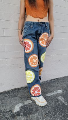 Painted fruit jeans Fabric Marker Ideas Jeans, Creative Jeans Design, Orange Denim Bottoms For Spring, Spring Orange Denim Bottoms, Painted Pants Design, Casual Orange Denim Jeans, Orange Straight Leg Jeans For Spring, Casual Orange Summer Jeans, Jean Painting Ideas Pocket