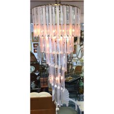 a large chandelier with many lights hanging from it's sides