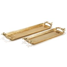 two gold trays with handles on each side