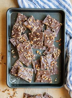 chocolate fudge bars on a tray with nuts