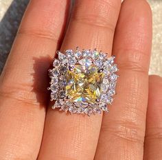 Yellow Diamond Ring featuring semi precious canary yellow stone and cz diamonds. Ideal to pair with your india western sarees and formal outfits. These large statement cocktail diamond ring will elevate your look. Perfect gift for her and gift for sister. *𝐏𝐑𝐎𝐃𝐔𝐂𝐓 𝐃𝐄𝐓𝐀𝐈𝐋* * 𝐌𝐚𝐭𝐞𝐫𝐢𝐚𝐥: Brass * 𝐏𝐥𝐚𝐭𝐢𝐧𝐠: White Rhodium Plated * 𝐒𝐭𝐨𝐧𝐞: AAA-quality CZ Diamond. 𝐕𝐢𝐬𝐢𝐭 𝐎𝐮𝐫 𝐅𝐀𝐐𝐬 𝐟𝐨𝐫 𝐒𝐡𝐢𝐩𝐩𝐢𝐧𝐠 𝐏𝐨𝐥𝐢𝐜𝐢𝐞𝐬 𝐚𝐧𝐝 𝐂𝐚𝐫𝐞 𝐈𝐧𝐬𝐭𝐫𝐮𝐜𝐭𝐢𝐨𝐧 *𝐃𝐈𝐒𝐂𝐋𝐀𝐈𝐌𝐄𝐑* * Product color may slightly vary due to photographic lighting sources or your screen settings. * Stone color may vary slightly due to variations in natural stones. *𝐒𝐈𝐌𝐈𝐋𝐀𝐑 𝐃𝐄𝐒𝐈𝐆𝐍* https://www.etsy.com/listing/1146740753/ Western Sarees, Cocktail Diamond Ring, Ring Yellow Diamond, Yellow Stone Ring, Yellow Stone Rings, Replica Jewelry, Yellow Diamond Rings, Designer Replica, Formal Outfits