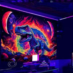 a dinosaur mural on the side of a wall in a dark room with neon lights